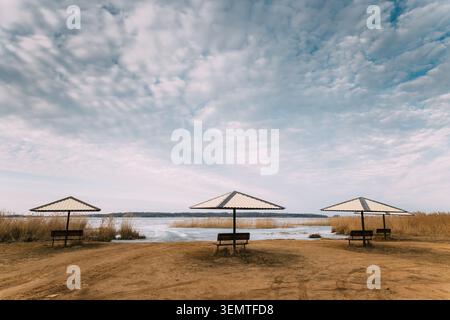 Sandy beach on the shore of Lake Osveya in early spring. Stock Photo