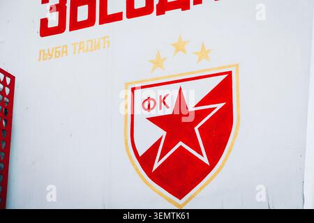 18 April 2026, Belgrade, Serbia: Red Star Belgrade, FK Crvena zvezda club logo and text celebrating Ljuba Tadic painted on a white wall Stock Photo