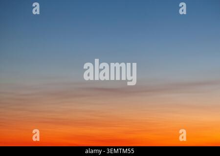 Clear and empty blue and orange gradient sky for background, horizontal image Stock Photo