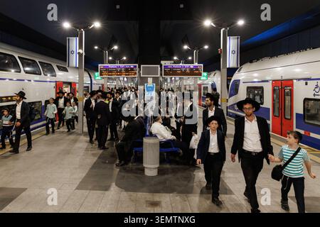 Crowded platform with Ultra-Orthodox Jewish passengers at Yitzhak Navon railway station, Jerusalem, Israel Stock Photo