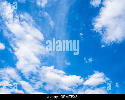 white clouds in dark blue sky over Yerevan city on spring afternoon Stock Photo