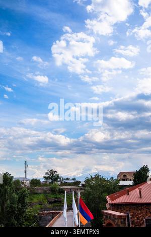 gray clouds over Hrazdan Gorge in Yerevan city and Ararat Mount on spring evening Stock Photo