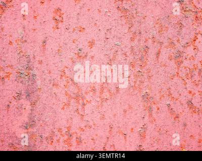 textured background - rusty, peeling surface of sheet of metal painted with red lead Stock Photo