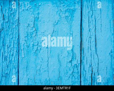 textured background - wooden boards painted with cracked and peeling blue paint close-up Stock Photo