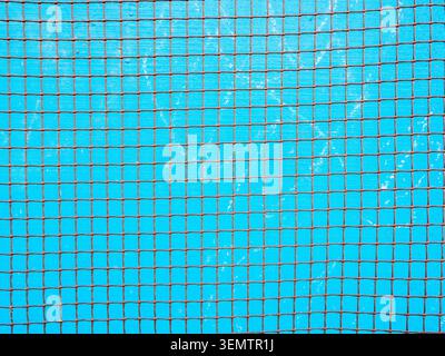textured background - rusty steel bar mesh grating and blue painted slate sheet surface in background Stock Photo