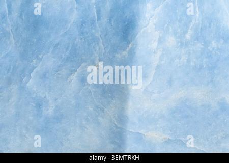 natural mineral background - surface of polished blue calcite rock close-up Stock Photo