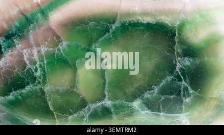 natural mineral panoramic background - surface of polished green fluorite rock close-up Stock Photo