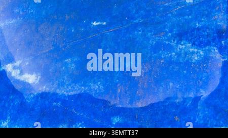 natural mineral panoramic background - surface of polished dark blue lapis lazuli rock close-up Stock Photo