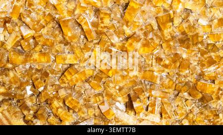 natural mineral panoramic background - surface of crystalline yellow baryte rock close-up Stock Photo