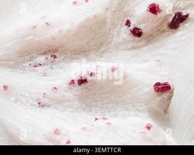 natural mineral background - red purple ruby crystals in quartz rock close-up Stock Photo