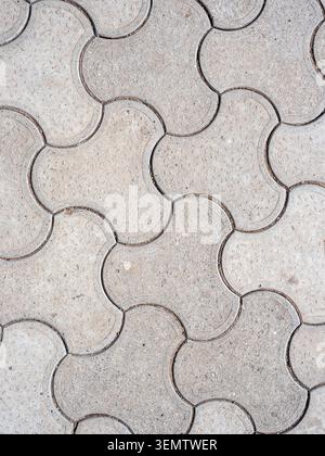 top view of concrete propeller pavers on surface of walkway Stock Photo