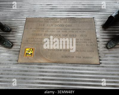 Liverpool, UK - May 16, 2026: Commemorative bronze plaque with inscription on metal steps beside public sculptures in Liverpool city centre. Stock Photo
