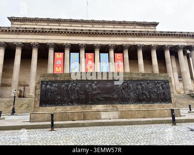 Liverpool, UK - May 16, 2026: Historic cenotaph relief at St George's Hall with colorful Music Month banners and grand neoclassical columns in Liverpo Stock Photo