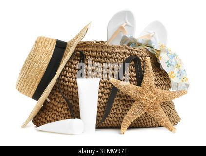 Knitted bag with beach accessories isolated on white Stock Photo