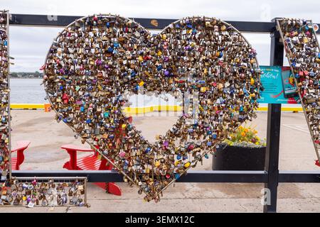 Charlottetown Canada, 1st September 2025: Close view of a heart shaped love lock display covered with thousands of colourful padlocks on the Charlotte Stock Photo