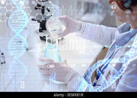Medical research scientist pouring liquid in laboratory beaker with DNA and heartbeat overlays, healthcare innovation and biotechnology Stock Photo