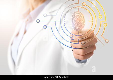 Digital fingerprint scan for biometric security and data protection, businesswoman activating advanced authentication system Stock Photo