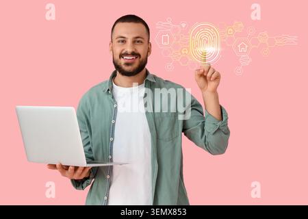 Man with laptop interacting with digital fingerprint security system and smart home icons on pink background, the biometric authentication interface i Stock Photo