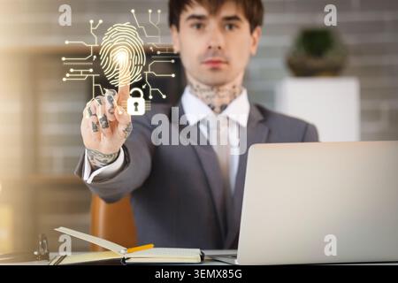 Biometric fingerprint security system access with man using digital touchscreen interface for data protection, the glowing fingerprint and padlock ico Stock Photo