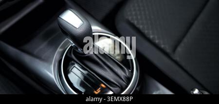 Modern automatic car gear shift lever in vehicle interior, automotive technology and driving experience Stock Photo