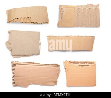 Recycled cardboard pieces with torn edges, brown paper texture, and corrugated material for packaging and craft projects Stock Photo