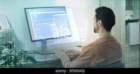 Software developer working on computer with code overlay, programming and digital technology concept, modern office environment Stock Photo