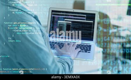 Software developer coding on laptop, digital data overlay, programming and cybersecurity, information technology Stock Photo