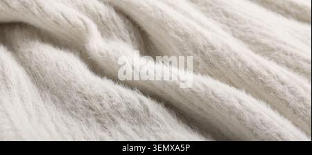 Soft white knitted wool fabric texture background, cozy warm winter clothing material, close up textile pattern Stock Photo