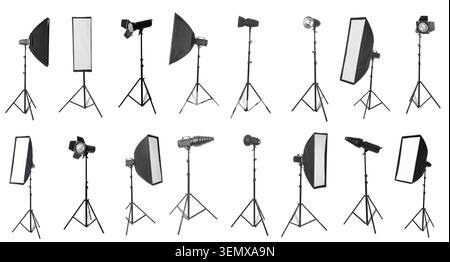 Professional studio lighting equipment collection with softboxes, reflectors, and strobe lights on tripods for photography Stock Photo