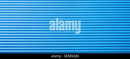 Blue corrugated plastic texture background with horizontal grooves and parallel lines, abstract pattern for design and decoration Stock Photo