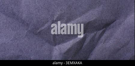 Dark blue crumpled paper texture background with rough fibers and creases, abstract surface for design and art projects, creased Stock Photo