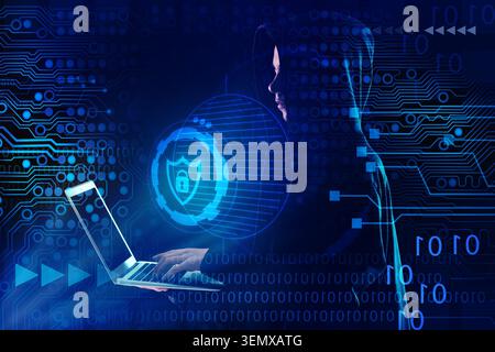 Cybersecurity data protection with hacker using laptop and digital circuit board background, a hacker in a hoodie uses a laptop, surrounded by a glowi Stock Photo