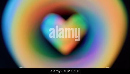 Heart frame circular. Blur flare romantic. Defocused yellow green color sparkle lens flare glare flicker gleam on abstract dark black background. Stock Photo