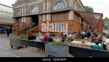 Al fresco food and drinks outside historic Altrincham Market House, a town-centre destination food scene venue in Trafford served by Metrolink Stock Photo