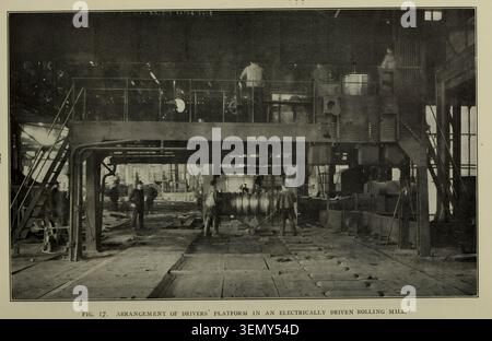 Industrial workers operating heavy rolling mill machinery from a driver's platform in a busy factory, performing manufacturing tasks during the early 20th century. From the Article GAS AND ELECTRIC POWER IN CONTINENTAL IRON AND STEEL WORKS. By J . B. van Brussel. From The Engineering Magazine Devoted to Industrial Progress Volume XXXIII April - September 1907 The Engineering Magazine Co Stock Photo