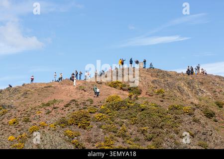 People at the summit of Arthur's Seat, the highest point in Edinburgh, Holyrood Park, Edinburgh, Scotland, UK Stock Photo