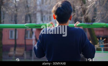 Handsome young man relaxing outdoors in the beautiful public nature park Stock Photo