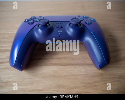 Sitges, Spain - June 06, 2026: A close-up editorial shot of a Sony PlayStation 5 DualSense wireless controller in Galactic Purple metallic finish on a Stock Photo
