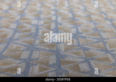 Blue and beige geometric carpet texture background Stock Photo