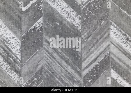 Grey herringbone wallpaper texture with weathered stone pattern Stock Photo