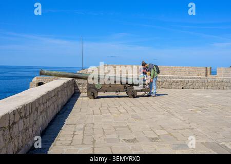 Tourist family exploring Fort Lovrijenac - St. Lawrence Fortress interior in Dubrovnik, Croatia Stock Photo
