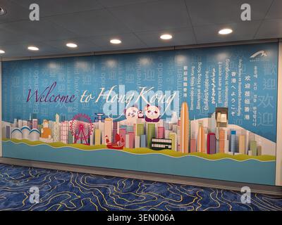 Welcome to Hong Kong mural with pandas and city skyline at Hong Kong International Airport terminal Stock Photo