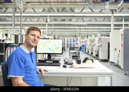 portrait of a worker in the engineering department of a factory for the production and construction of electronics Stock Photo