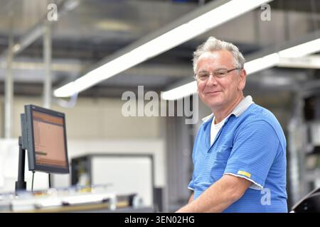 portrait of a worker in the engineering department of a factory for the production and construction of electronics Stock Photo