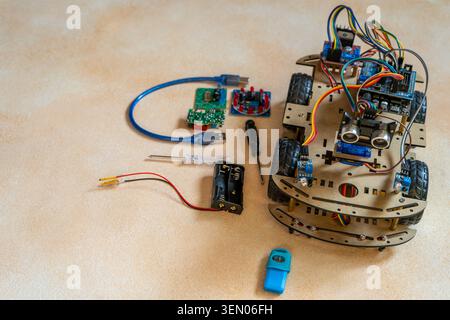 DIY Robot Car components. Educational electronics project for STEM learning and robotics. Stock Photo