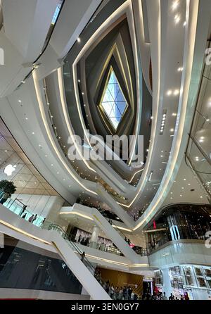 Mall of mirrors: sweeping white curves spiral up the futuristic atrium of ICONSIAM, Bangkok, Thailand Stock Photo