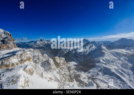 Snow-covered mountain range under a deep blue sky. Stock Photo
