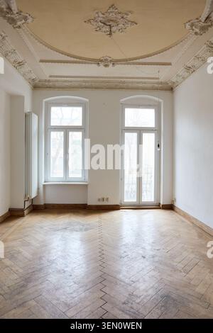 This captures an empty room in an older building in Berlin s Prenzlauer Berg district, showcasing the space before renovation. It represents the begin Stock Photo