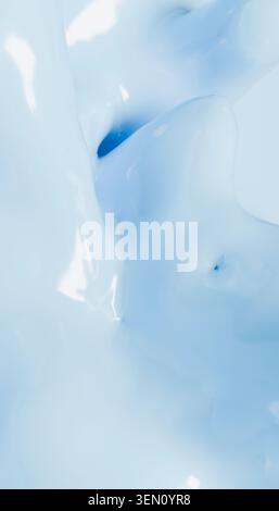 Abstract close-up of glossy white and blue fluid texture with a smooth appearance. Stock Photo