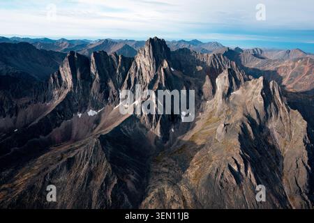 Rugged mountain range with sharp peaks under a clear blue sky. Stock Photo